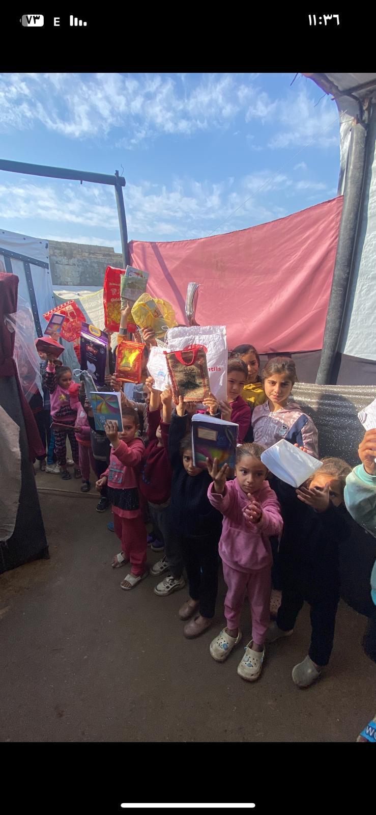 Children holding new school supplies